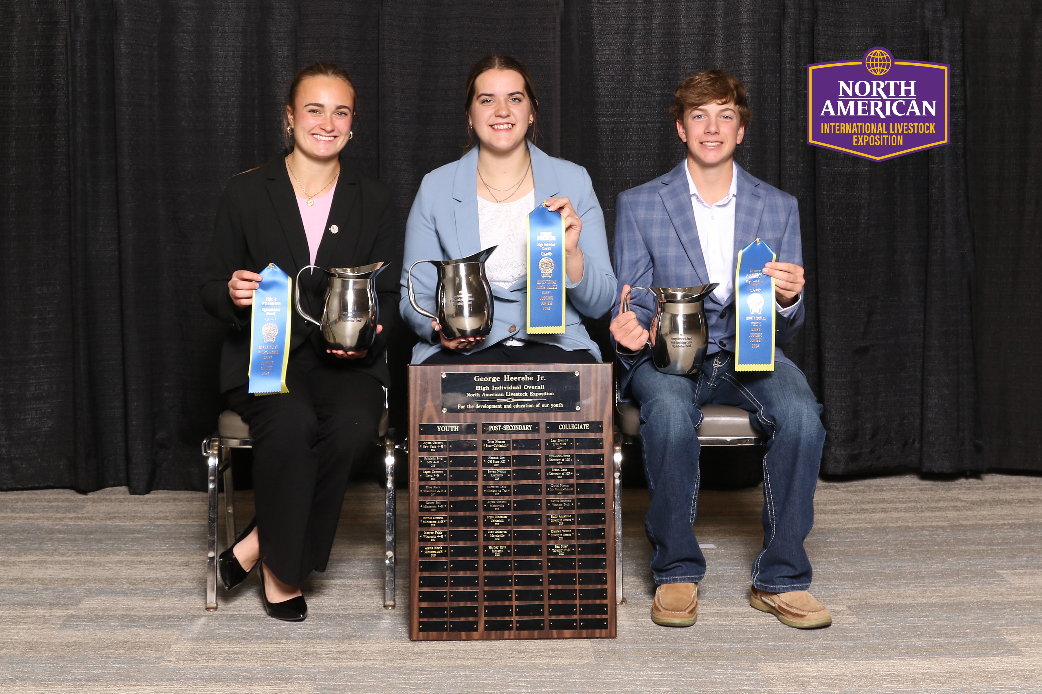 Two Girls and a boy holding awards