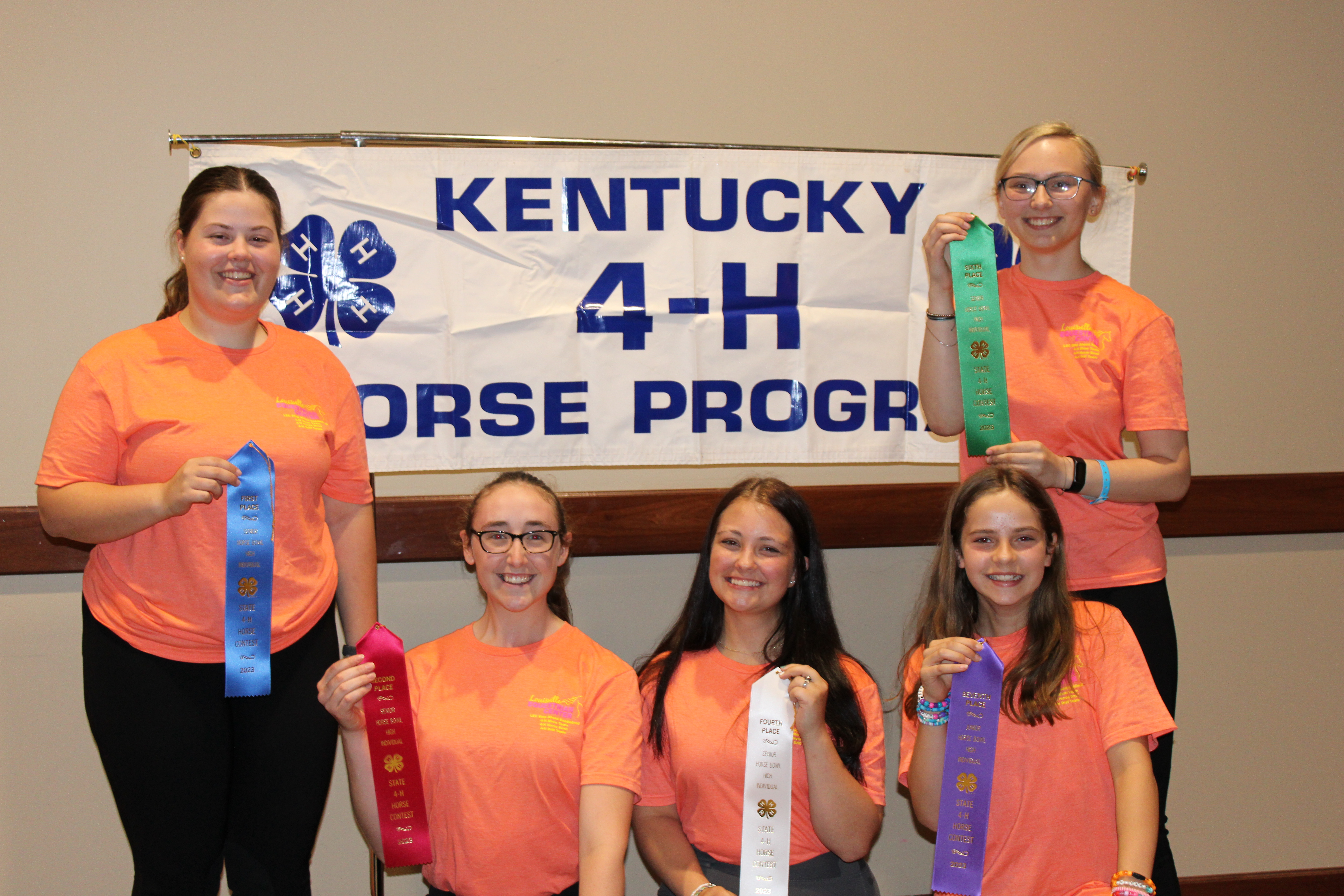 Youth standing with ribbons