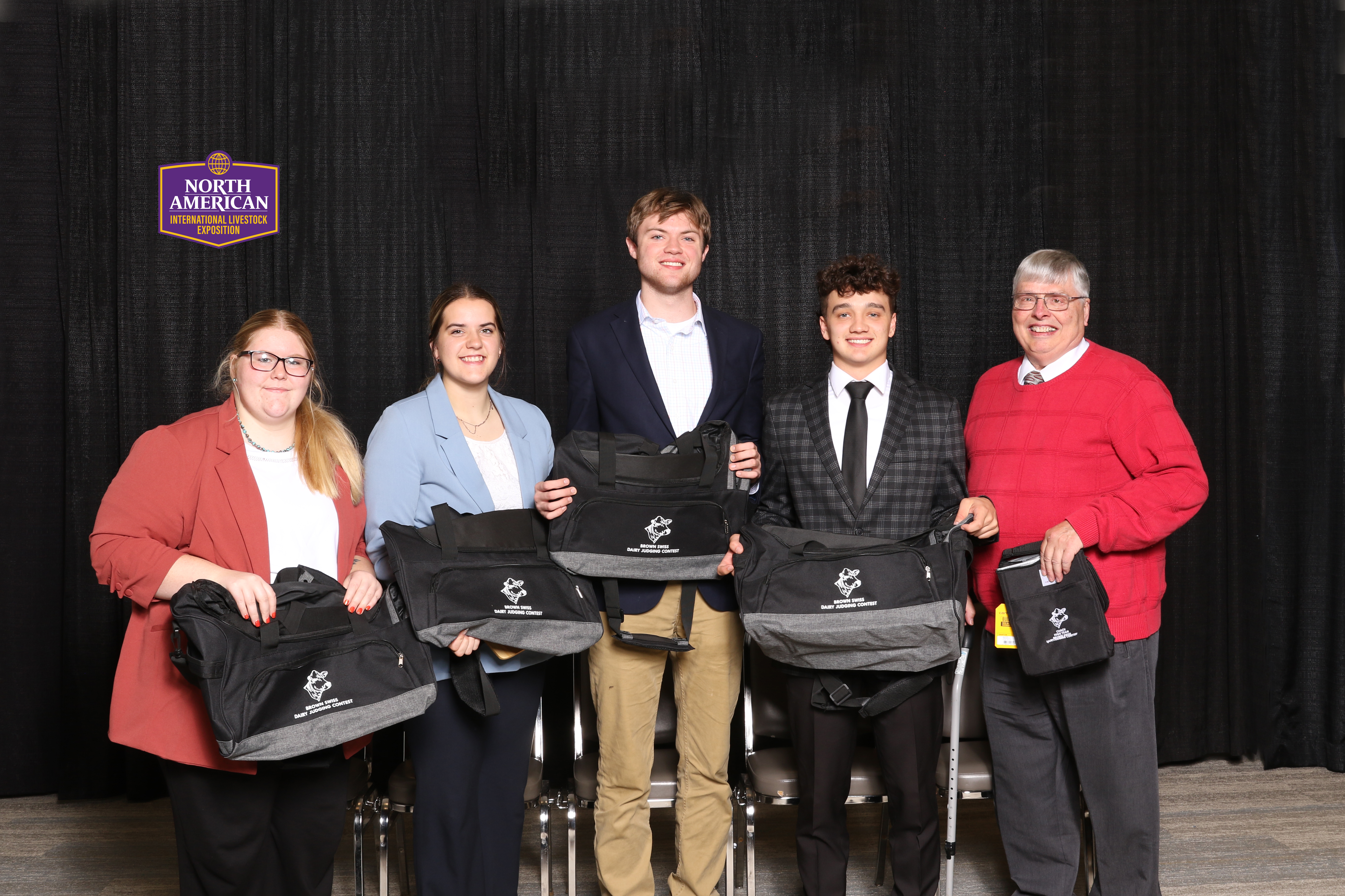 teenagers holding duffle bags