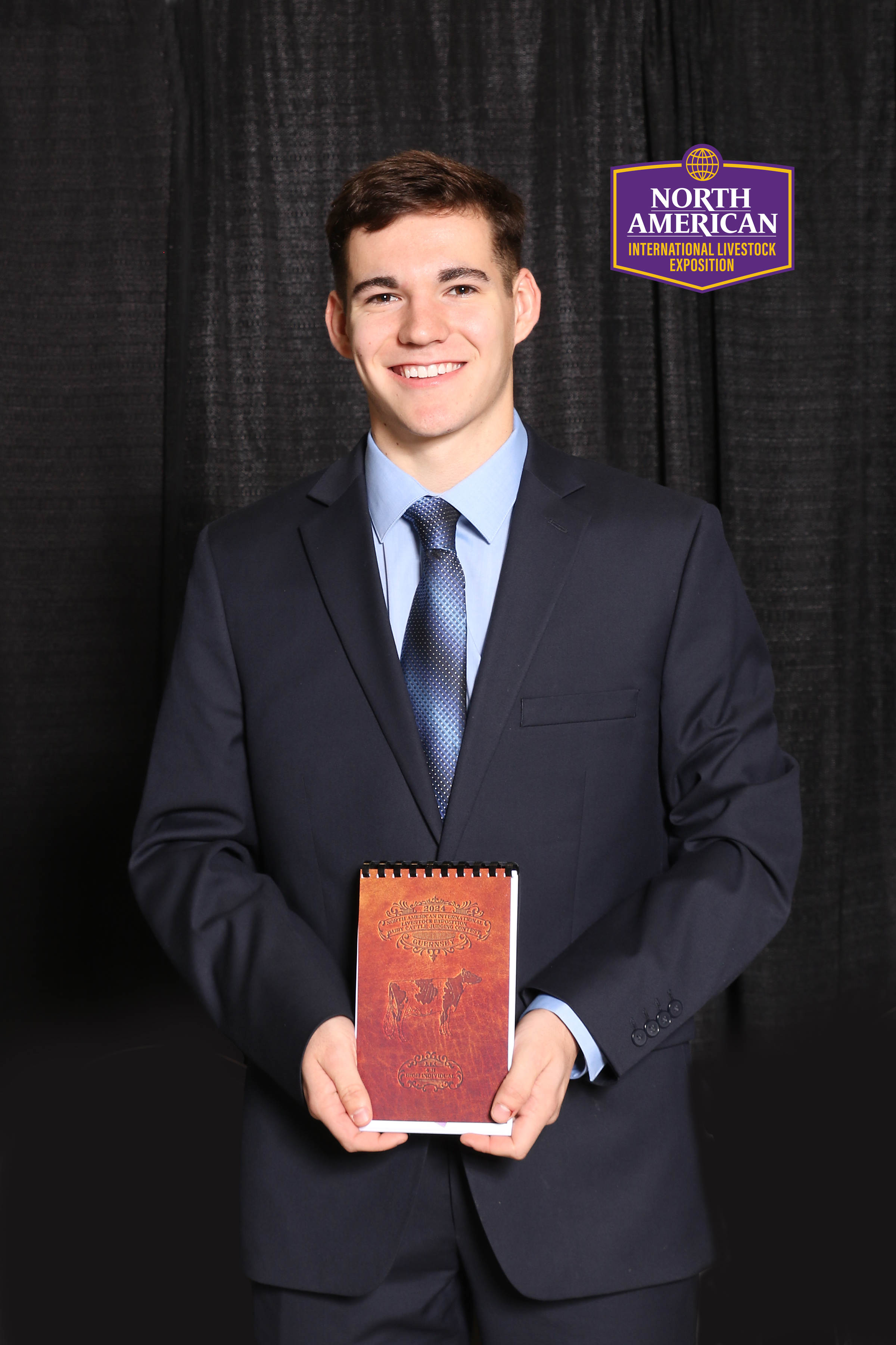 Boy holding notebook