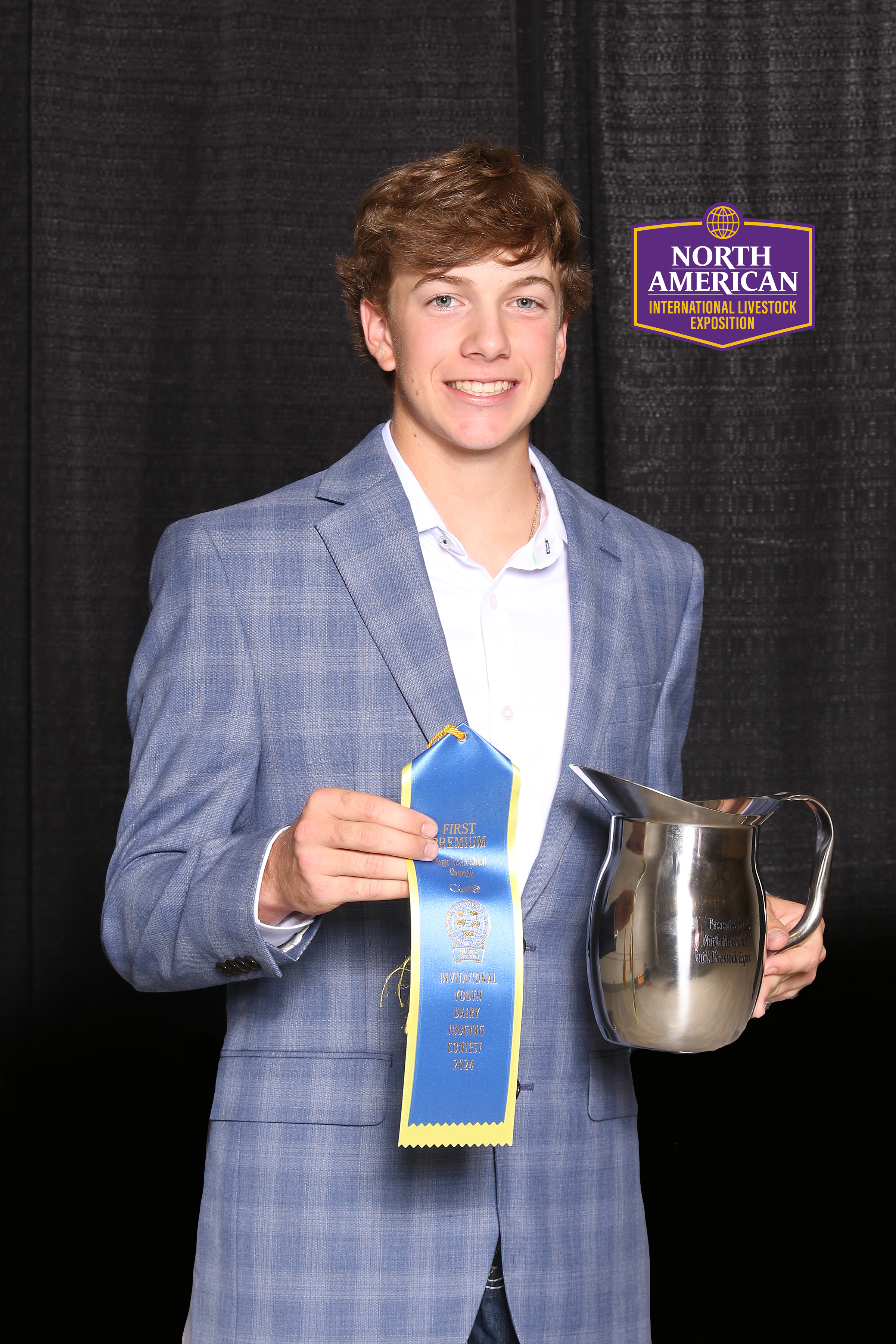 Boy holding pitcher