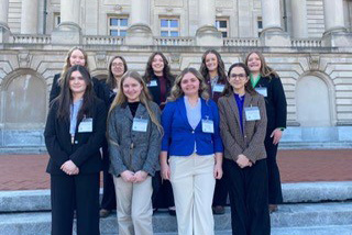 ETF students stand in front of the state Capitol